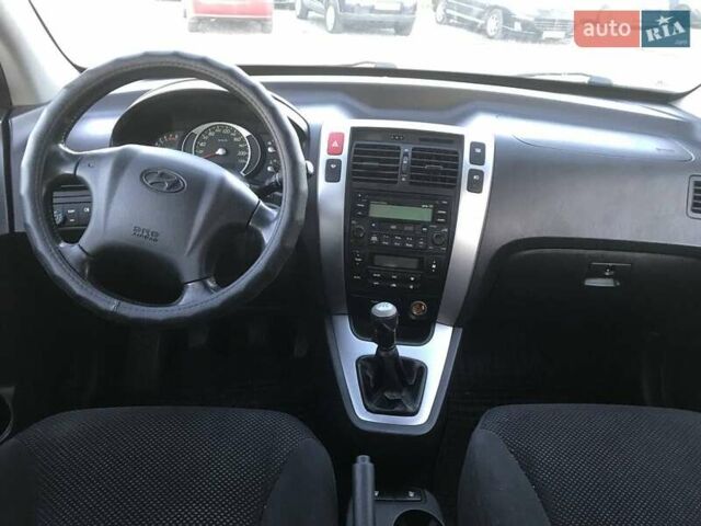 Синий Хендай Туксон, объемом двигателя 2 л и пробегом 207 тыс. км за 7990 $, фото 8 на Automoto.ua