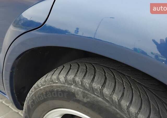 Синий Хендай Туксон, объемом двигателя 1.98 л и пробегом 201 тыс. км за 9400 $, фото 12 на Automoto.ua