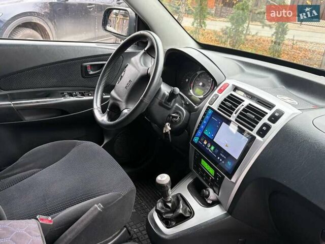 Синий Хендай Туксон, объемом двигателя 1.98 л и пробегом 163 тыс. км за 7990 $, фото 25 на Automoto.ua