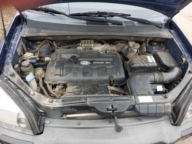 Синий Хендай Туксон, объемом двигателя 2 л и пробегом 170 тыс. км за 8500 $, фото 3 на Automoto.ua