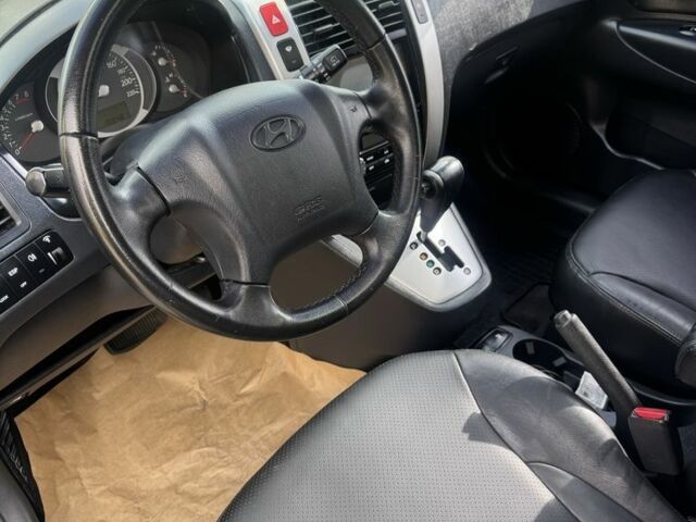 Синий Хендай Туксон, объемом двигателя 2 л и пробегом 198 тыс. км за 7999 $, фото 4 на Automoto.ua