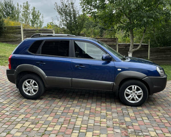 Синій Хендай Туксон, об'ємом двигуна 1.98 л та пробігом 230 тис. км за 6555 $, фото 4 на Automoto.ua