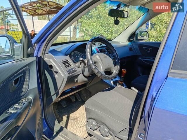 Синий Хендай Туксон, объемом двигателя 1.98 л и пробегом 203 тыс. км за 7000 $, фото 17 на Automoto.ua