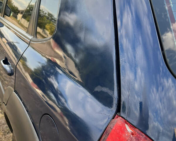 Синий Хендай Туксон, объемом двигателя 1.98 л и пробегом 210 тыс. км за 4500 $, фото 7 на Automoto.ua