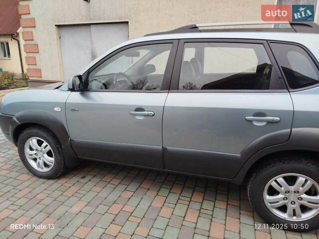 Синий Хендай Туксон, объемом двигателя 2 л и пробегом 213 тыс. км за 8900 $, фото 17 на Automoto.ua