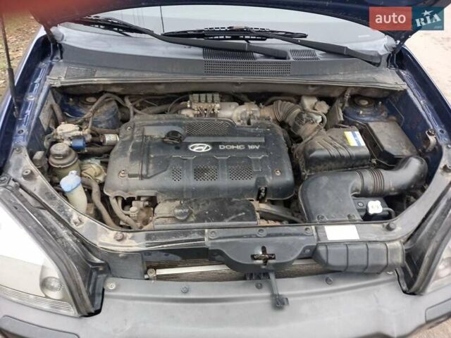 Синий Хендай Туксон, объемом двигателя 2 л и пробегом 170 тыс. км за 8500 $, фото 2 на Automoto.ua