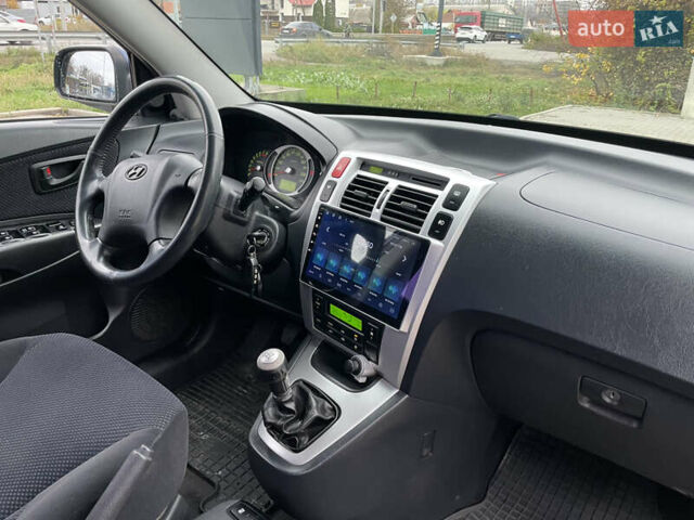 Синий Хендай Туксон, объемом двигателя 1.98 л и пробегом 163 тыс. км за 8000 $, фото 19 на Automoto.ua