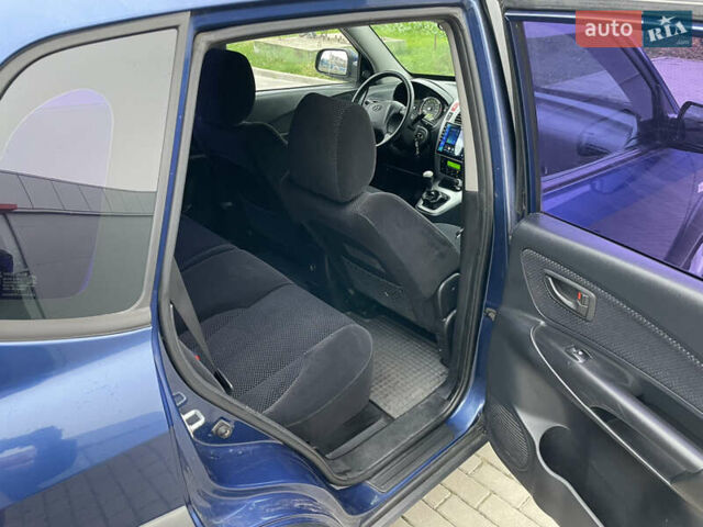 Синий Хендай Туксон, объемом двигателя 1.98 л и пробегом 163 тыс. км за 8000 $, фото 15 на Automoto.ua