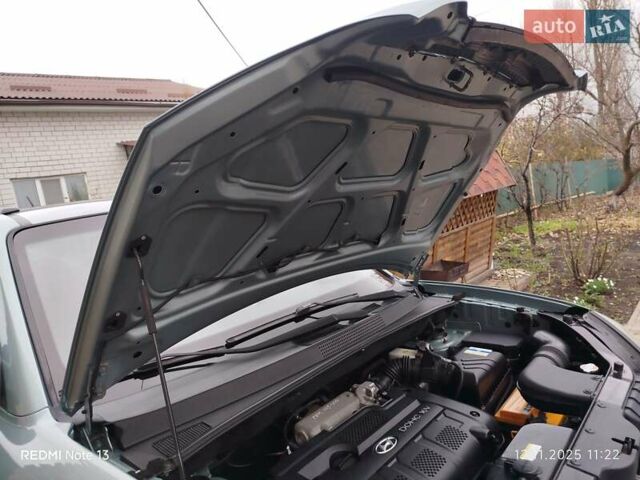 Синий Хендай Туксон, объемом двигателя 2 л и пробегом 213 тыс. км за 8900 $, фото 82 на Automoto.ua