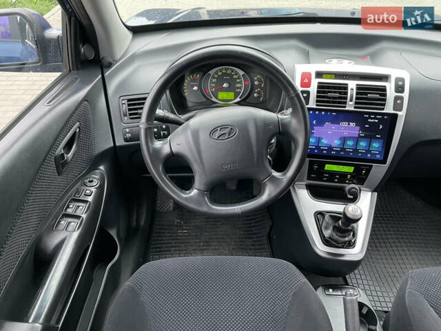 Синий Хендай Туксон, объемом двигателя 1.98 л и пробегом 163 тыс. км за 8000 $, фото 21 на Automoto.ua