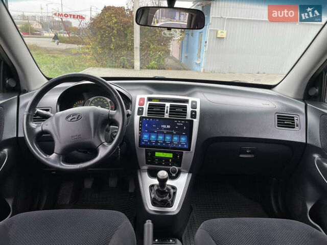 Синий Хендай Туксон, объемом двигателя 1.98 л и пробегом 163 тыс. км за 8000 $, фото 20 на Automoto.ua