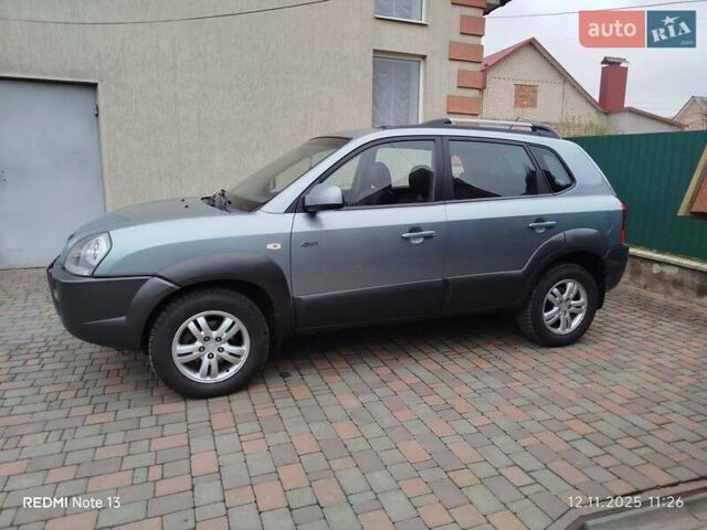 Синий Хендай Туксон, объемом двигателя 2 л и пробегом 213 тыс. км за 8900 $, фото 92 на Automoto.ua