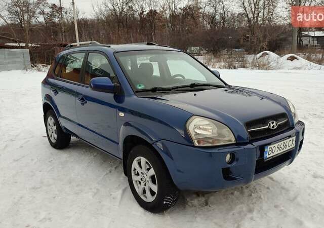 Синий Хендай Туксон, объемом двигателя 1.98 л и пробегом 228 тыс. км за 7700 $, фото 3 на Automoto.ua