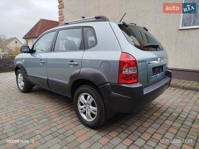 Синий Хендай Туксон, объемом двигателя 2 л и пробегом 213 тыс. км за 8900 $, фото 98 на Automoto.ua