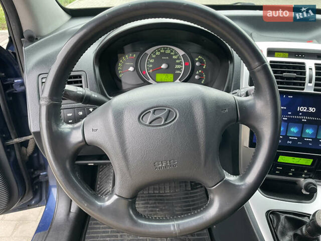 Синий Хендай Туксон, объемом двигателя 1.98 л и пробегом 163 тыс. км за 8000 $, фото 23 на Automoto.ua