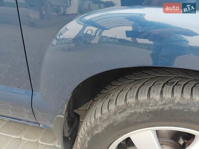 Синий Хендай Туксон, объемом двигателя 1.98 л и пробегом 201 тыс. км за 9400 $, фото 4 на Automoto.ua