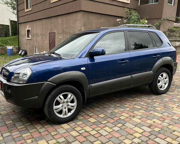 Синій Хендай Туксон, об'ємом двигуна 1.98 л та пробігом 230 тис. км за 6555 $, фото 2 на Automoto.ua