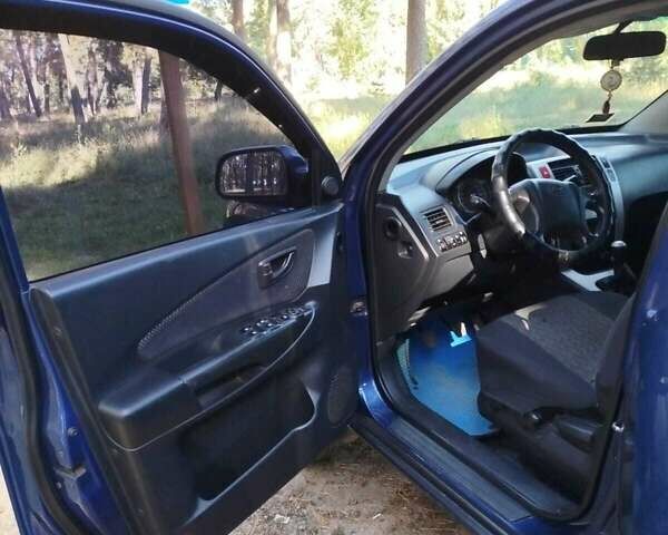 Синий Хендай Туксон, объемом двигателя 1.98 л и пробегом 267 тыс. км за 7300 $, фото 7 на Automoto.ua