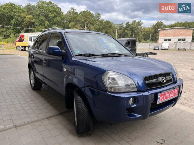 Синий Хендай Туксон, объемом двигателя 2 л и пробегом 218 тыс. км за 6700 $, фото 2 на Automoto.ua