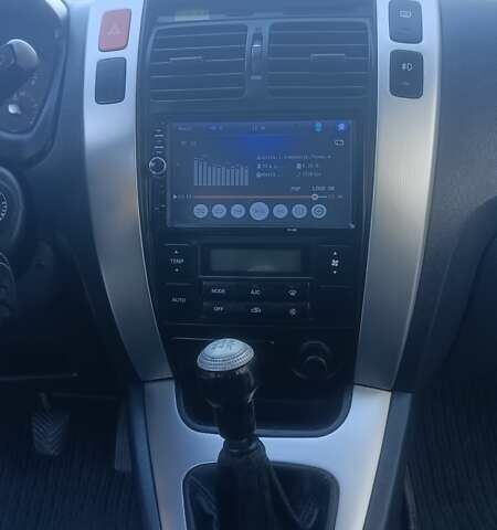 Синий Хендай Туксон, объемом двигателя 1.98 л и пробегом 183 тыс. км за 6700 $, фото 14 на Automoto.ua