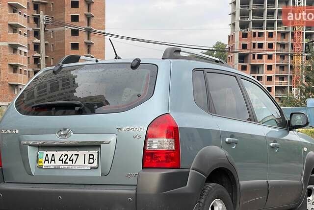 Синий Хендай Туксон, объемом двигателя 2.7 л и пробегом 220 тыс. км за 7900 $, фото 5 на Automoto.ua
