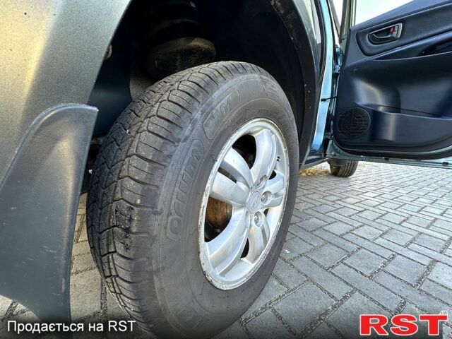 Хендай Туксон 2008 у Кременчуге на Automoto.ua Синій Хендай Туксон, об'ємом двигуна 2 л та пробігом 233 тис. км за 8300 $, фото 12 на Automoto.ua