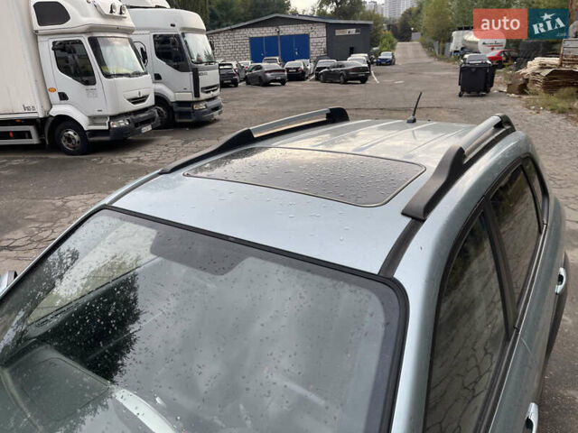 Синий Хендай Туксон, объемом двигателя 2.7 л и пробегом 220 тыс. км за 7900 $, фото 6 на Automoto.ua