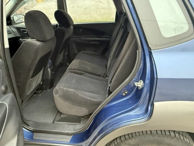 Синий Хендай Туксон, объемом двигателя 2 л и пробегом 279 тыс. км за 6280 $, фото 9 на Automoto.ua