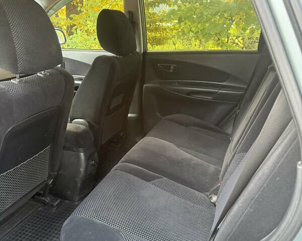 Синий Хендай Туксон, объемом двигателя 1.98 л и пробегом 200 тыс. км за 7700 $, фото 12 на Automoto.ua