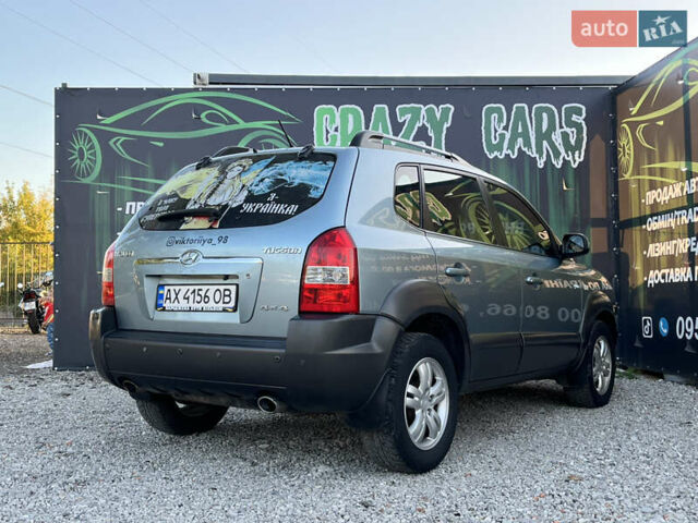 Синий Хендай Туксон, объемом двигателя 2 л и пробегом 317 тыс. км за 9600 $, фото 5 на Automoto.ua