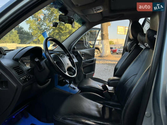 Синий Хендай Туксон, объемом двигателя 2 л и пробегом 317 тыс. км за 9600 $, фото 8 на Automoto.ua