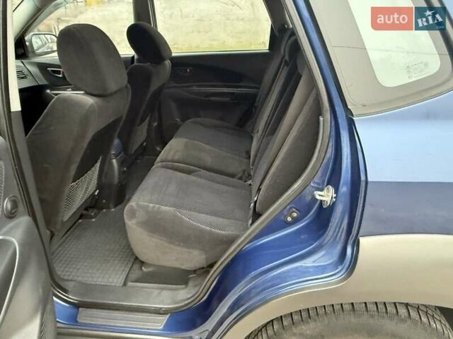 Синий Хендай Туксон, объемом двигателя 2 л и пробегом 270 тыс. км за 6250 $, фото 15 на Automoto.ua