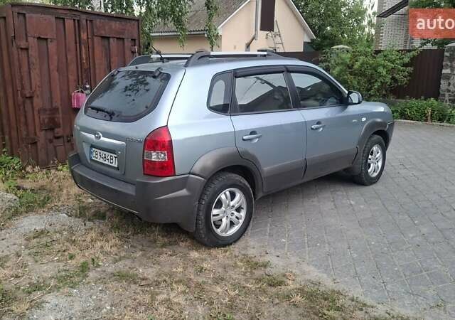 Синий Хендай Туксон, объемом двигателя 1.98 л и пробегом 310 тыс. км за 8200 $, фото 3 на Automoto.ua