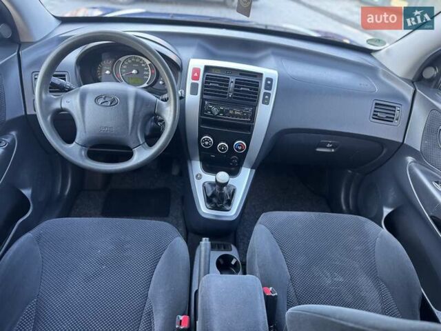 Синий Хендай Туксон, объемом двигателя 1.98 л и пробегом 178 тыс. км за 8700 $, фото 25 на Automoto.ua