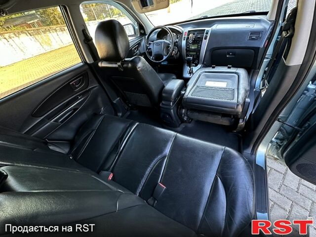 Синий Хендай Туксон, объемом двигателя 2 л и пробегом 233 тыс. км за 8300 $, фото 6 на Automoto.ua