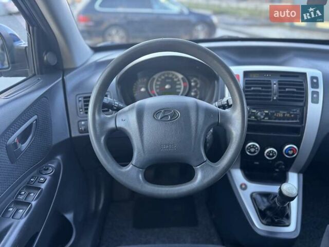 Синий Хендай Туксон, объемом двигателя 1.98 л и пробегом 178 тыс. км за 8700 $, фото 28 на Automoto.ua