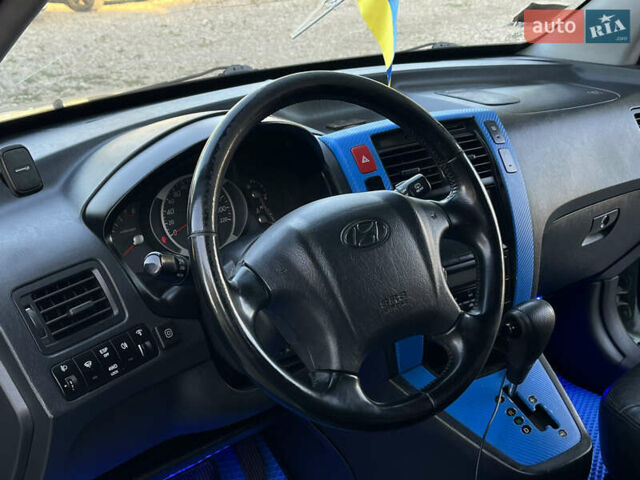 Синий Хендай Туксон, объемом двигателя 2 л и пробегом 317 тыс. км за 9600 $, фото 9 на Automoto.ua