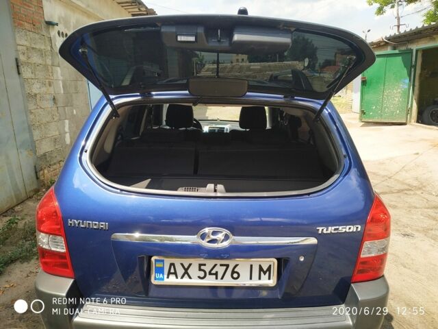 Синий Хендай Туксон, объемом двигателя 2 л и пробегом 200 тыс. км за 7600 $, фото 7 на Automoto.ua