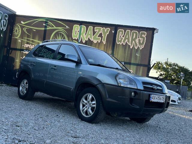 Синий Хендай Туксон, объемом двигателя 2 л и пробегом 317 тыс. км за 9600 $, фото 4 на Automoto.ua