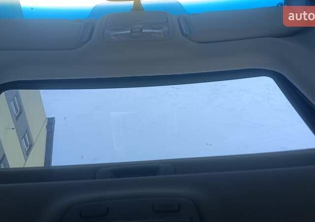 Синий Хендай Туксон, объемом двигателя 1.98 л и пробегом 183 тыс. км за 6700 $, фото 12 на Automoto.ua