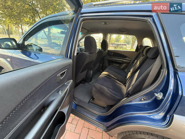 Синий Хендай Туксон, объемом двигателя 2 л и пробегом 168 тыс. км за 6900 $, фото 19 на Automoto.ua