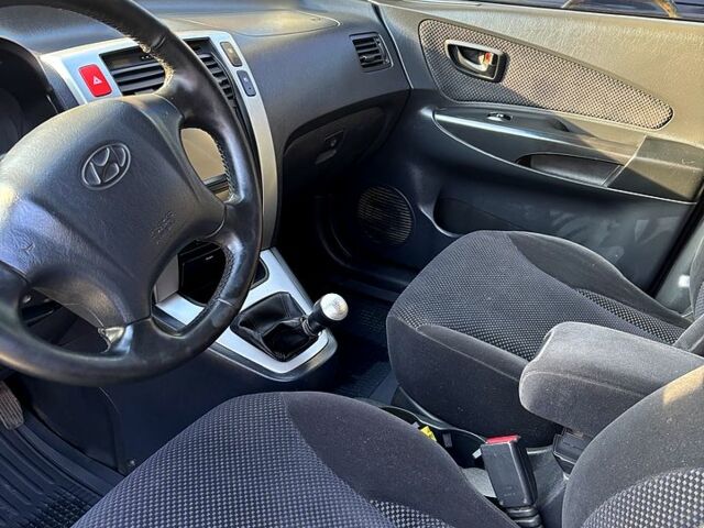 Синий Хендай Туксон, объемом двигателя 2 л и пробегом 208 тыс. км за 6700 $, фото 8 на Automoto.ua