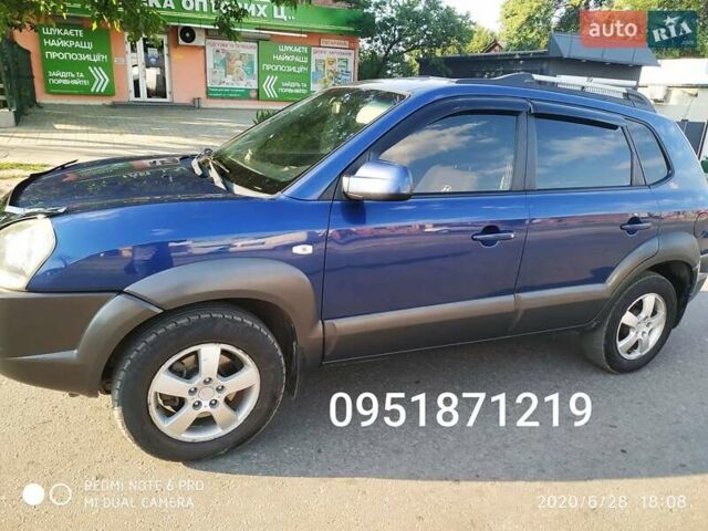 Синий Хендай Туксон, объемом двигателя 2 л и пробегом 200 тыс. км за 7600 $, фото 13 на Automoto.ua
