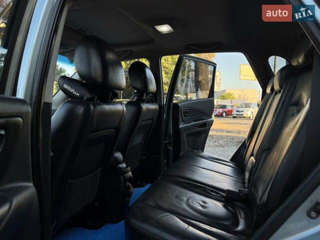 Синий Хендай Туксон, объемом двигателя 2 л и пробегом 317 тыс. км за 9600 $, фото 12 на Automoto.ua