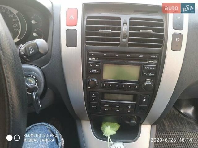 Синий Хендай Туксон, объемом двигателя 2 л и пробегом 200 тыс. км за 7600 $, фото 9 на Automoto.ua