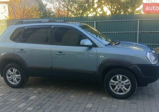 Синий Хендай Туксон, объемом двигателя 1.98 л и пробегом 183 тыс. км за 6700 $, фото 1 на Automoto.ua
