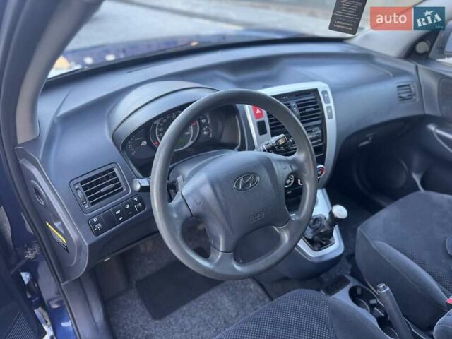 Синий Хендай Туксон, объемом двигателя 1.98 л и пробегом 178 тыс. км за 8700 $, фото 20 на Automoto.ua