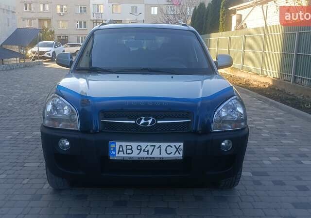 Синий Хендай Туксон, объемом двигателя 1.98 л и пробегом 183 тыс. км за 6700 $, фото 5 на Automoto.ua