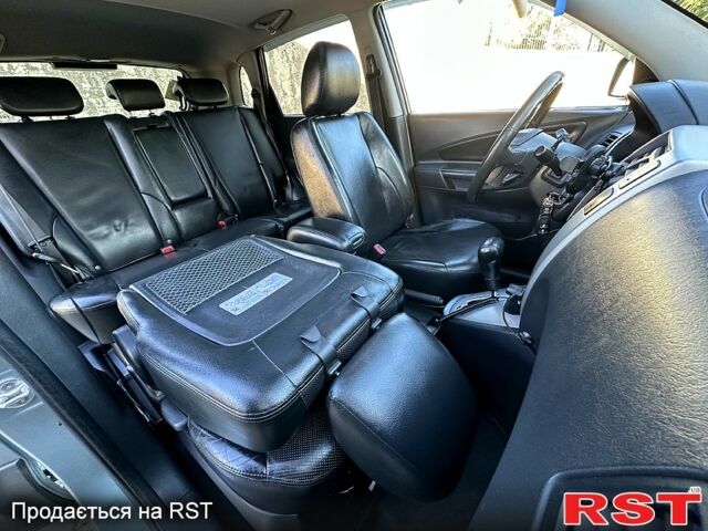 Синий Хендай Туксон, объемом двигателя 2 л и пробегом 233 тыс. км за 8300 $, фото 7 на Automoto.ua