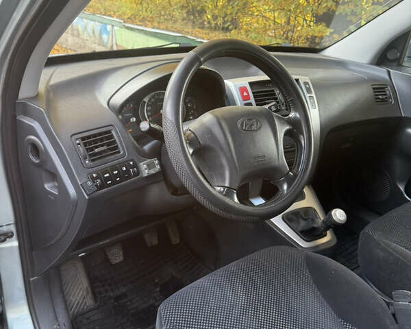 Синий Хендай Туксон, объемом двигателя 1.98 л и пробегом 200 тыс. км за 7700 $, фото 15 на Automoto.ua